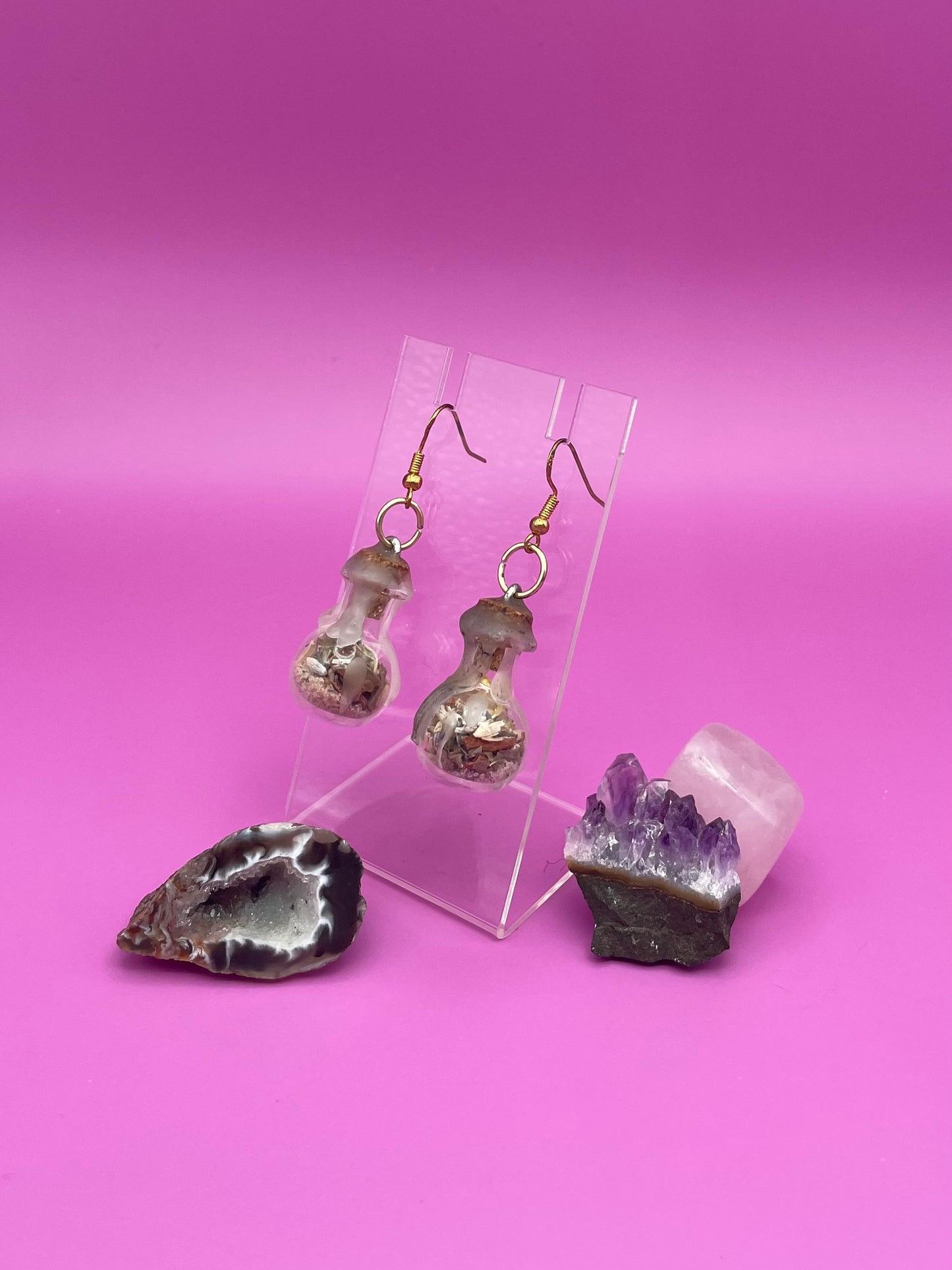 Academic success spell jar earrings on clear stand
