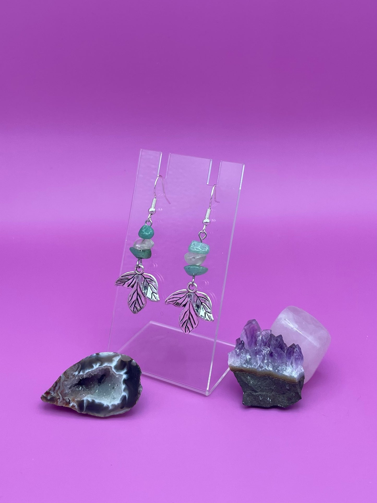 Silver leaf harm hanging with crystal chips above it, green aventurine and clear quartz in a pattern.