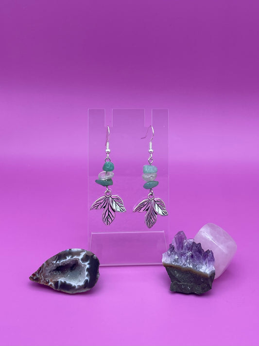 Silver leaf harm hanging with crystal chips above it, green aventurine and clear quartz in a pattern.